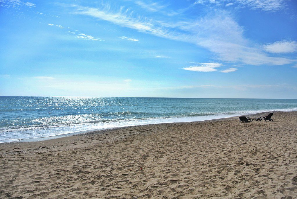 Wide sandy beach with sunbeds in Belek