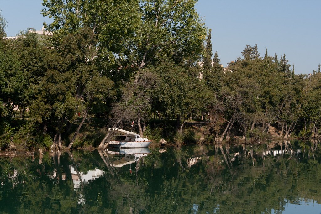 Boat moored on the Manavgat river among trees