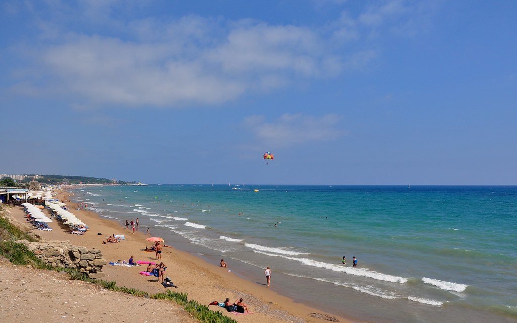 Sandy east beach in Side with sunbathers